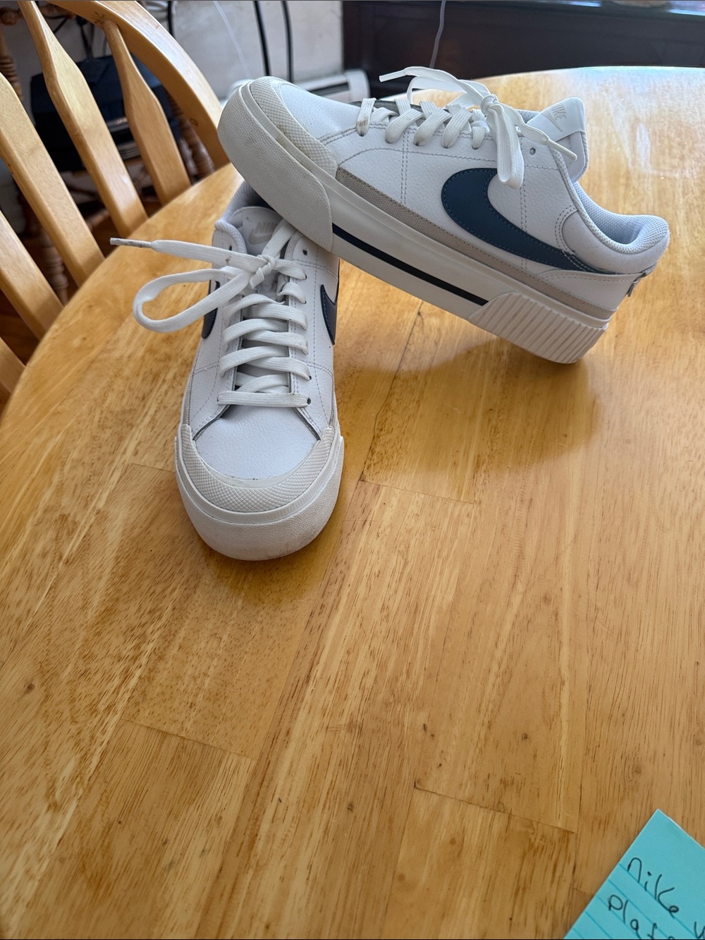 Nike White Sneakers with Blue Swoosh Accent